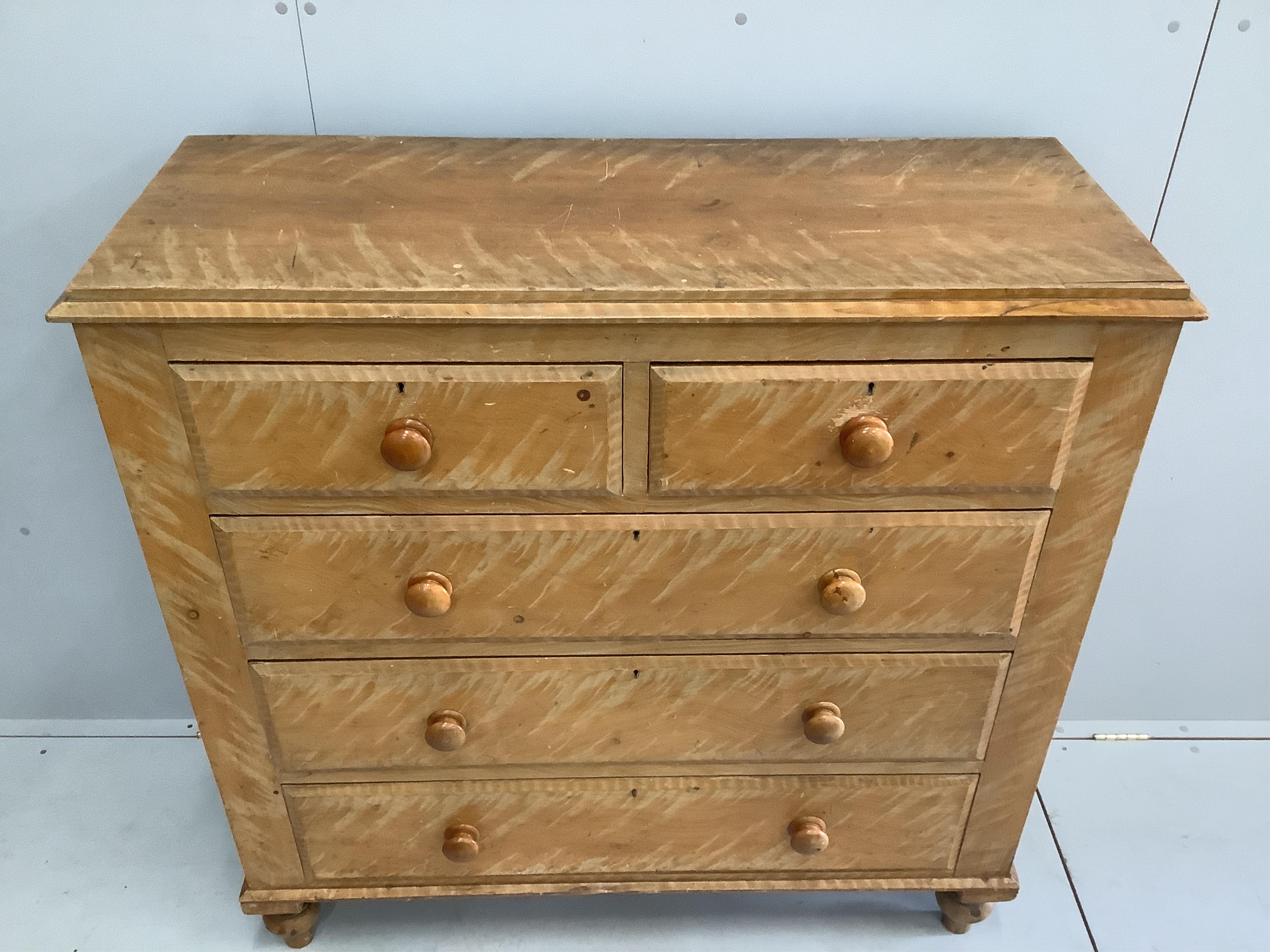 A late Victorian pine chest with painted simulated grain, width 119cm, depth 47cm, height 119cm. Condition - fair